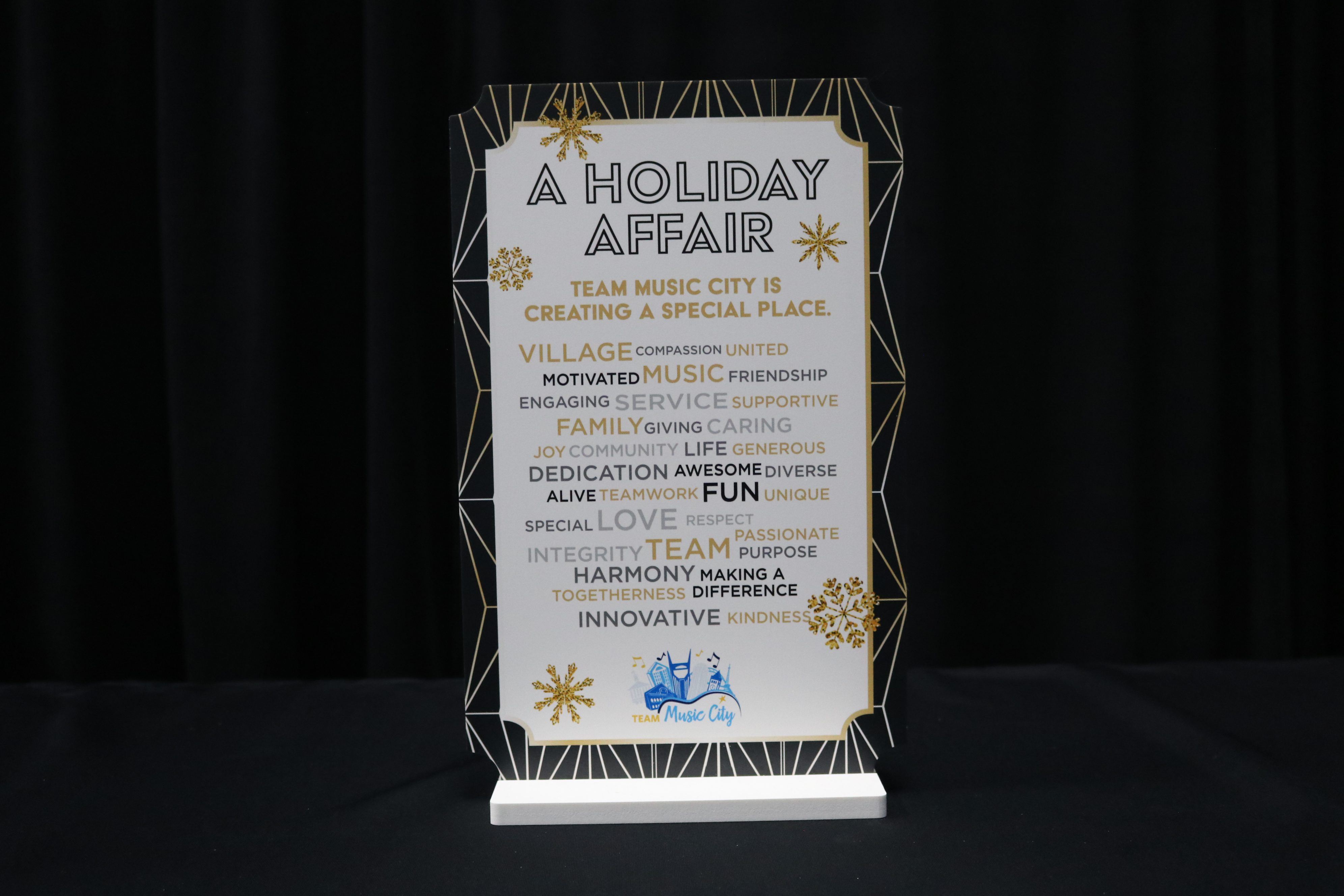 Table top display printed on PVC and inserted into base for a holiday party.
