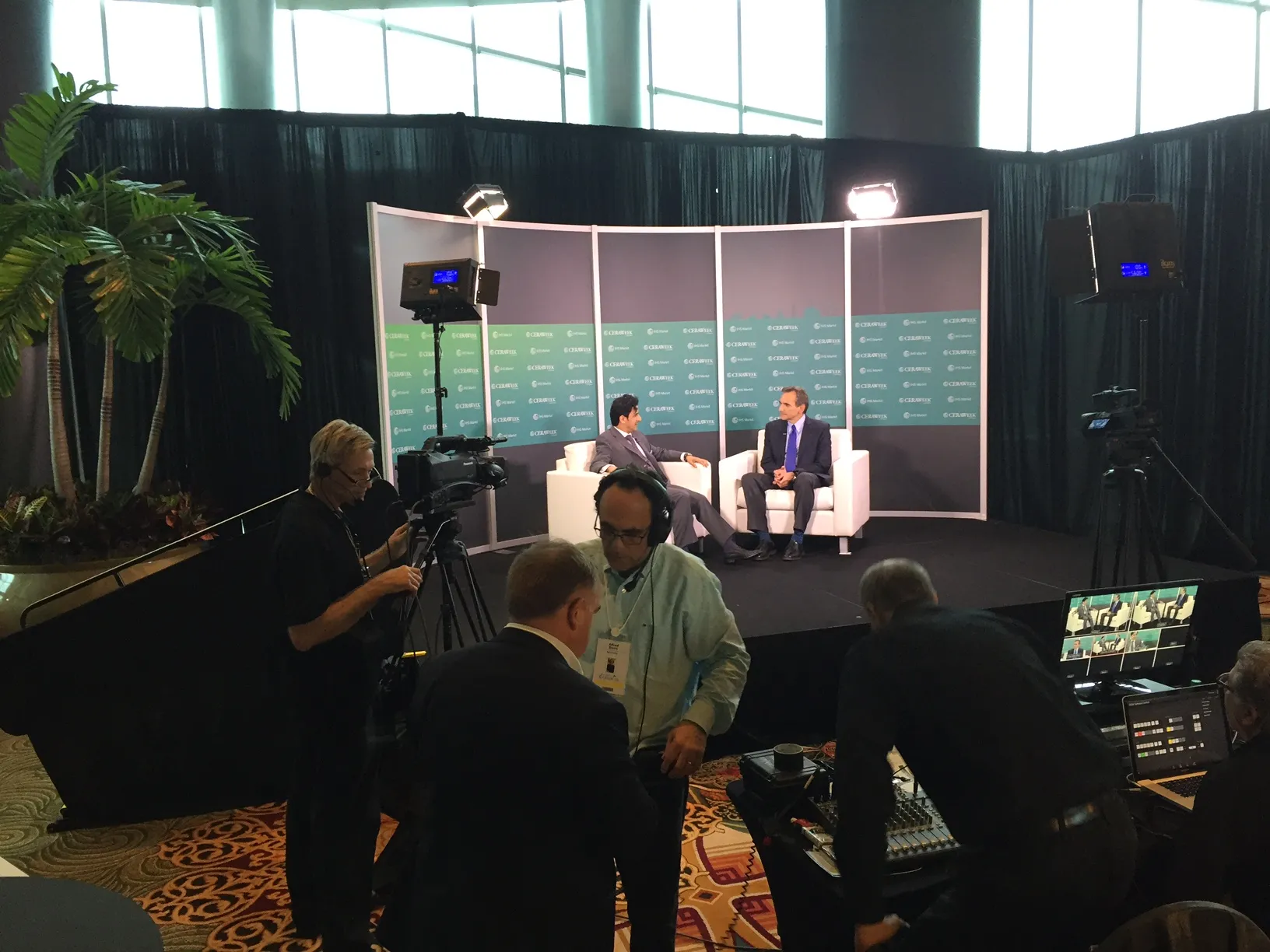 Custom event acrylic backdrop created with direct printed step and repeat designs on frosted acrylic panels held by a freestanding aluminum display system.